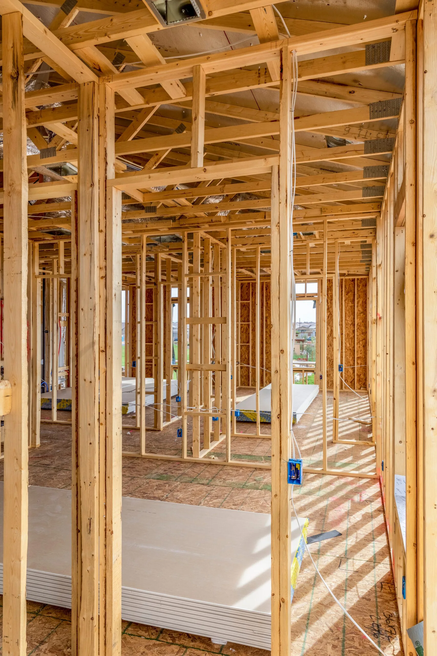 New,Home,Construction,With,Concrete,Slab,Flooring. Bare wood of a home under construction